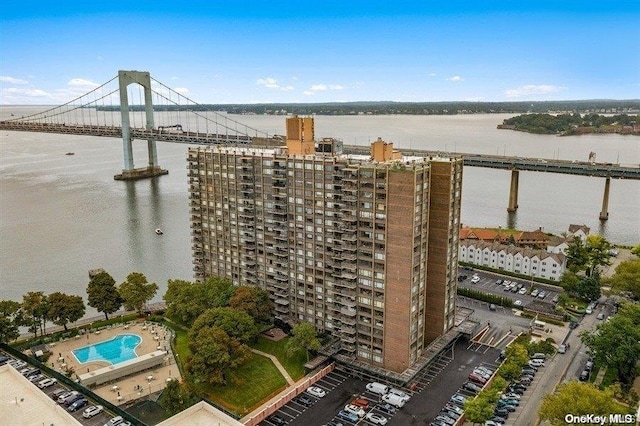 166-25 Powells Cove Blvd Unit 8D, Beechhurst, NY 11357 - bird's eye view of a nearby body of water, apartment complex / building, a notable bridge, and a pool
