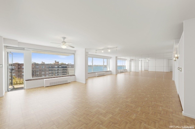 166-25 Powells Cove Blvd Unit 8D, Beechhurst, NY 11357 - unfurnished room with radiator, ceiling fan, and baseboards
