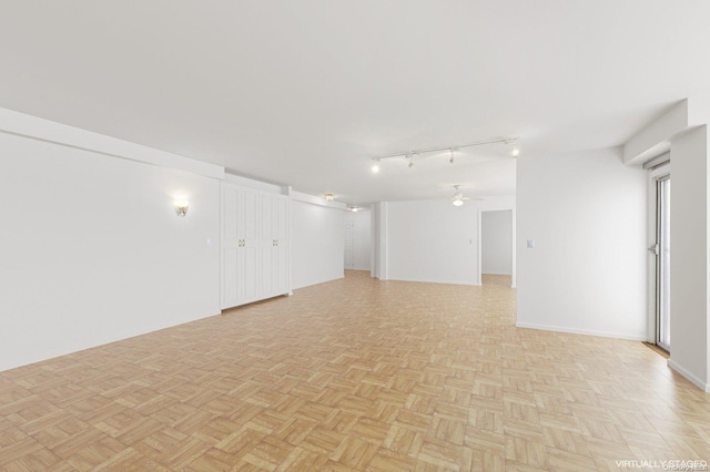166-25 Powells Cove Blvd Unit 8D, Beechhurst, NY 11357 - unfurnished room with rail lighting and ceiling fan