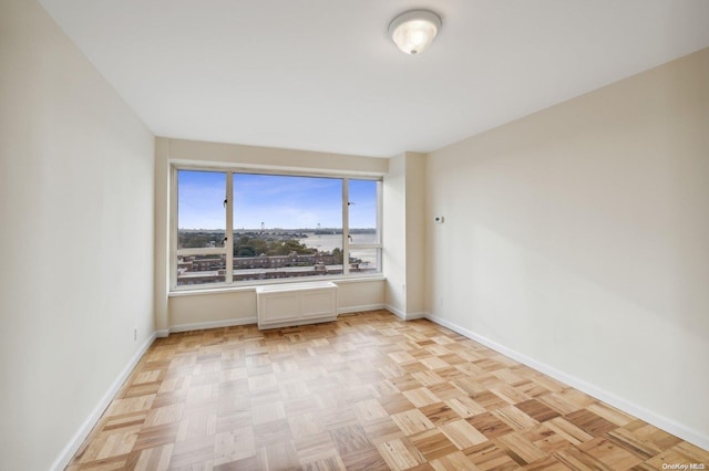 166-25 Powells Cove Blvd Unit 8D, Beechhurst, NY 11357 - spare room featuring baseboards
