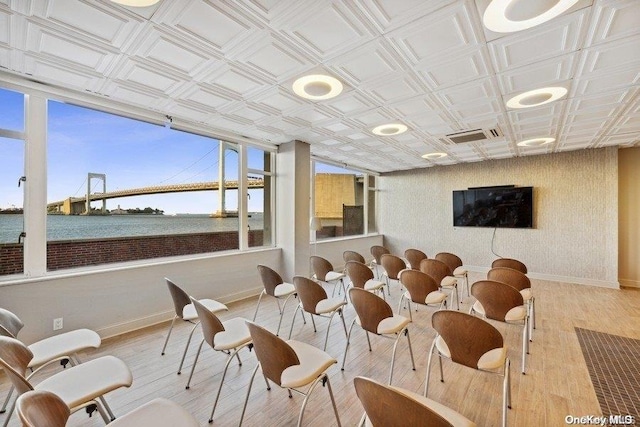 166-25 Powells Cove Blvd Unit 8D, Beechhurst, NY 11357 - dining area featuring baseboards, an ornate ceiling, wood finished floors, and a water view