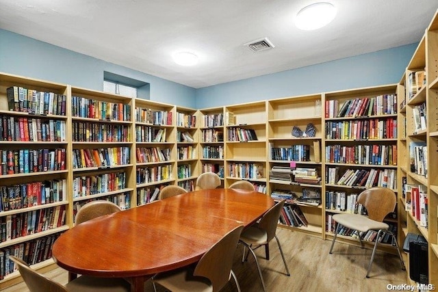 166-25 Powells Cove Blvd Unit 8D, Beechhurst, NY 11357 - living area with bookshelves and wood finished floors