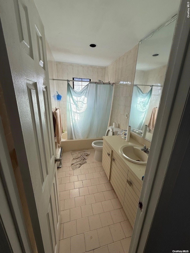 full bathroom featuring tile patterned floors, vanity, toilet, and shower / tub combo