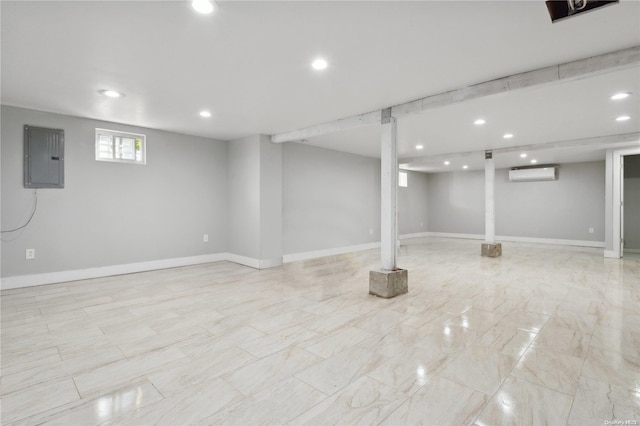 basement featuring a wall mounted air conditioner and electric panel