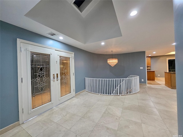 spare room with baseboards, recessed lighting, and visible vents