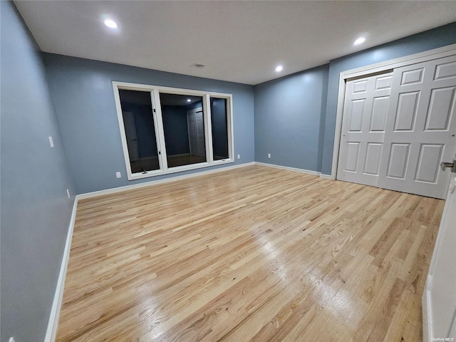 interior space featuring baseboards, recessed lighting, light wood-style flooring, and visible vents