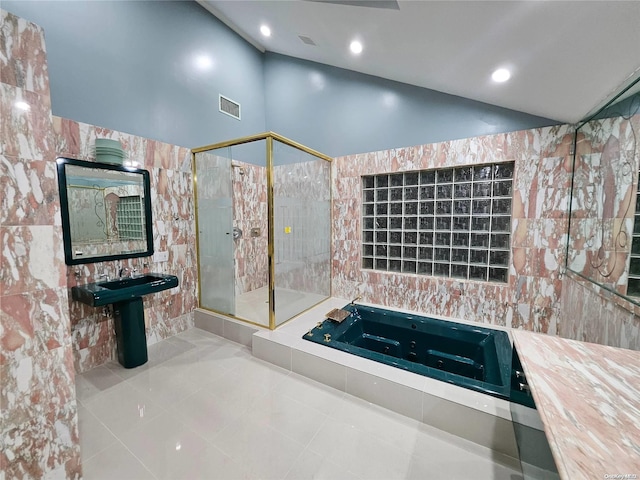 bathroom with visible vents, tile patterned flooring, a shower stall, vaulted ceiling, and a whirlpool tub