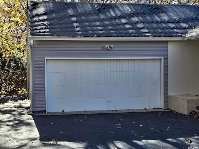 garage featuring driveway
