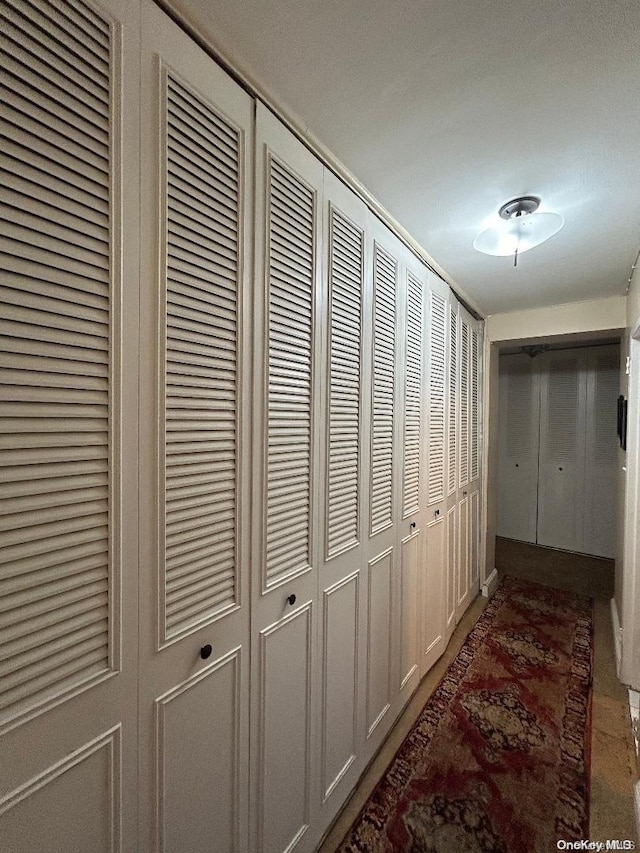 corridor featuring a textured ceiling