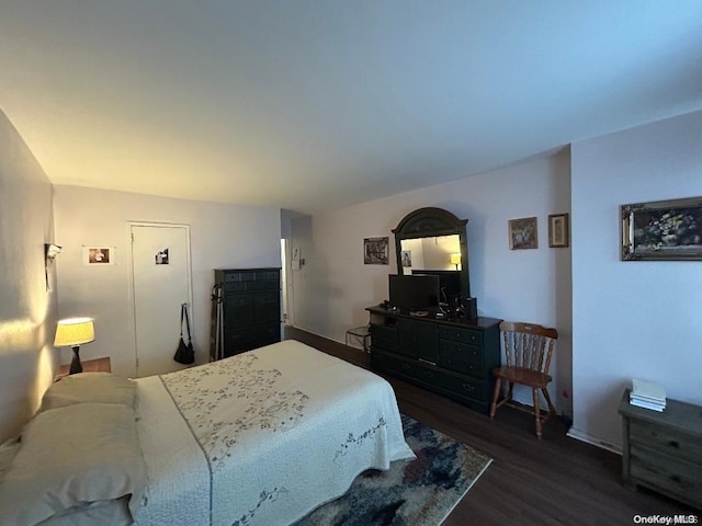 bedroom featuring dark hardwood / wood-style flooring