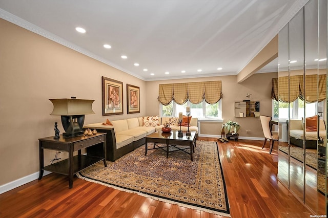 living room with hardwood / wood-style floors and ornamental molding