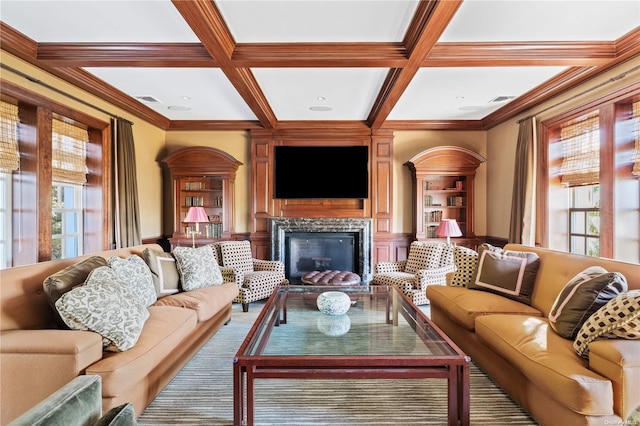 living room with beam ceiling, crown molding, and coffered ceiling