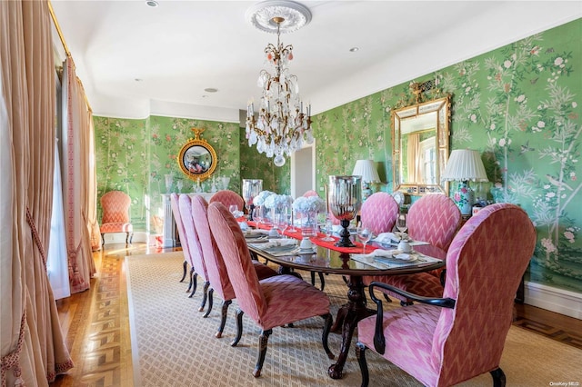 dining area with an inviting chandelier and light parquet floors