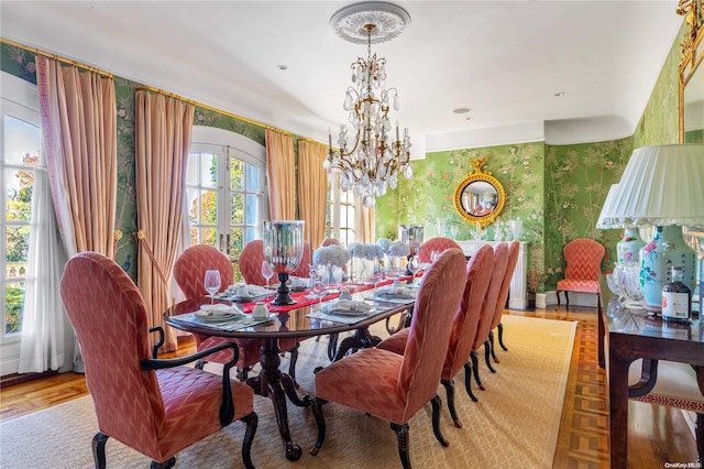 dining area featuring an inviting chandelier and light wood-type flooring