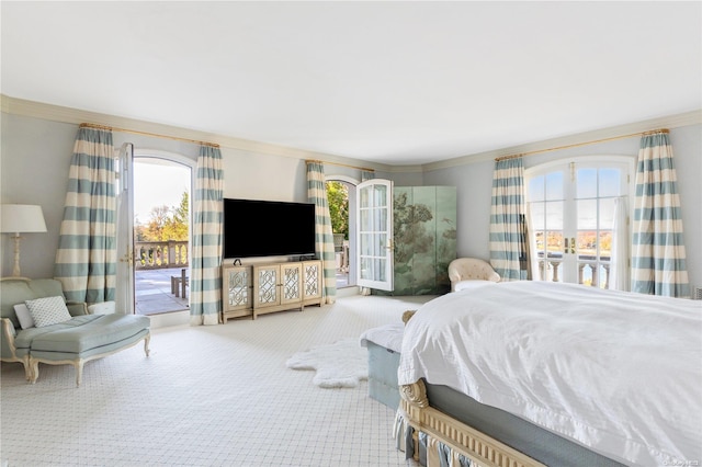 carpeted bedroom with access to exterior and crown molding