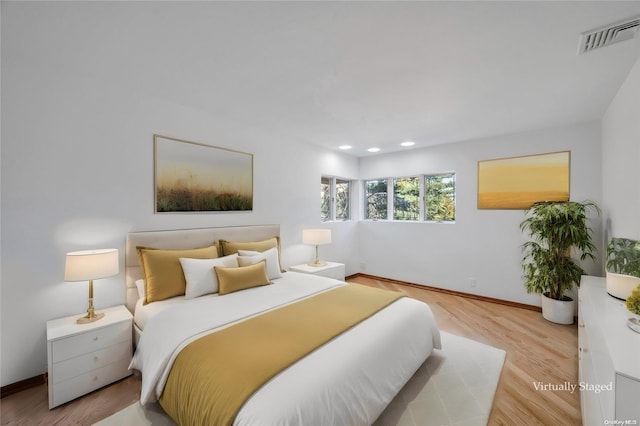 bedroom with light hardwood / wood-style floors