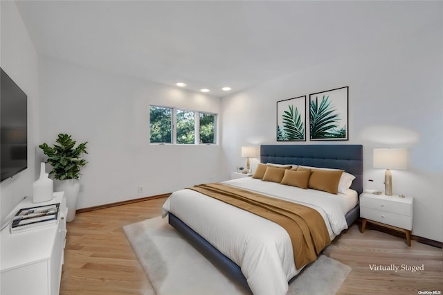 bedroom with light hardwood / wood-style floors