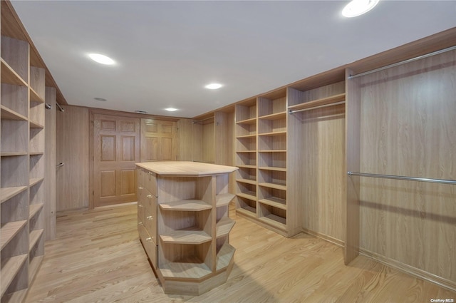 walk in closet featuring light hardwood / wood-style flooring