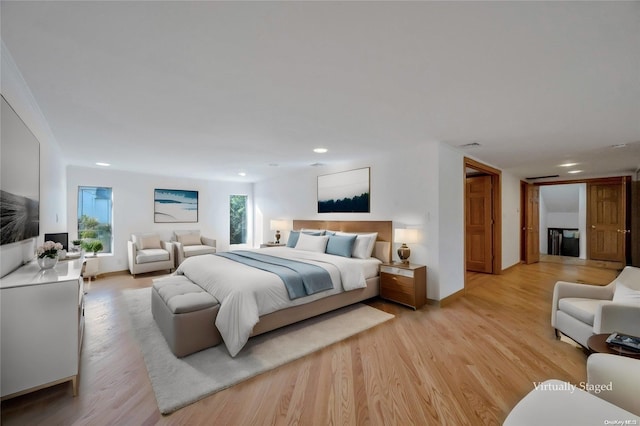 bedroom with light hardwood / wood-style flooring