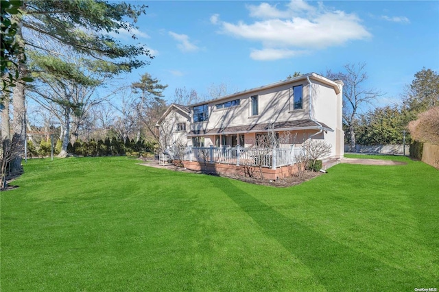 rear view of house with a lawn