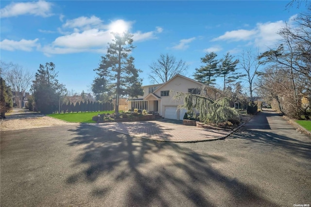 view of side of property with a garage