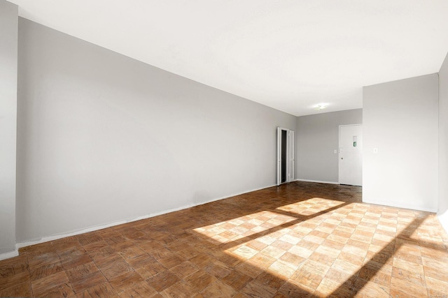 spare room with parquet flooring