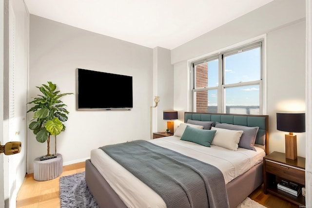 bedroom featuring parquet flooring