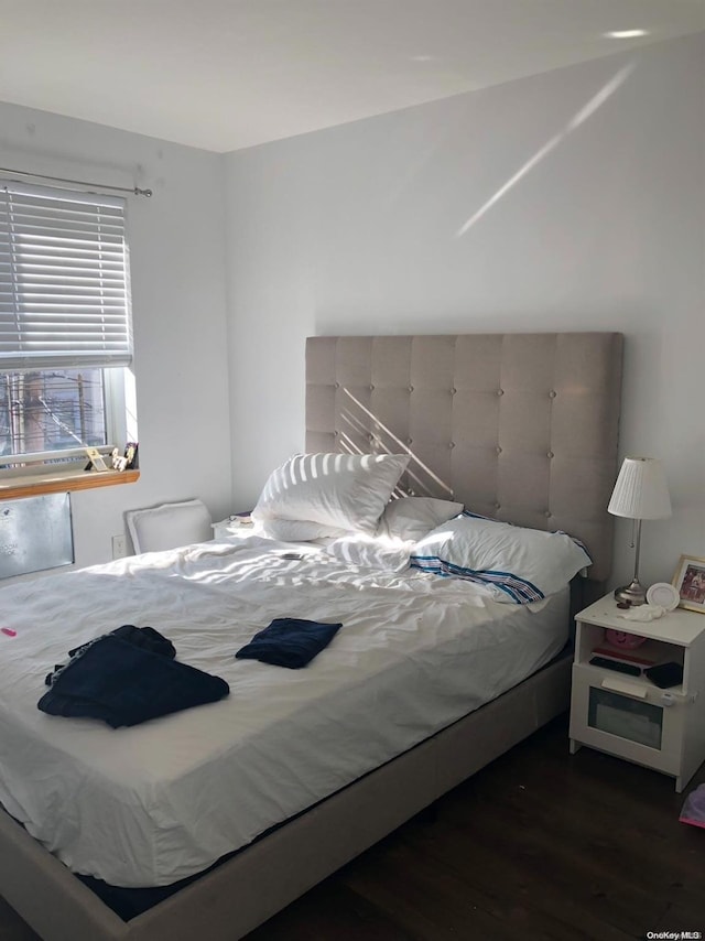 bedroom featuring dark wood-type flooring