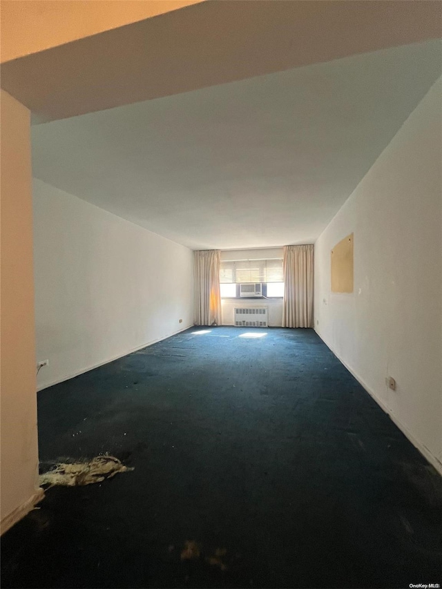 138-25 31st Dr Unit 3E, Flushing, NY 11354 - carpeted spare room featuring radiator heating unit