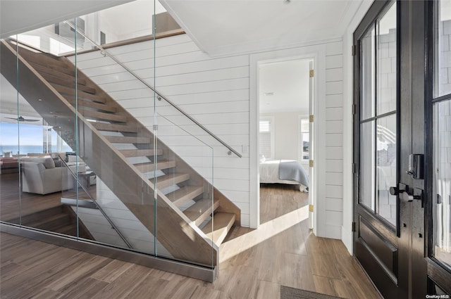 interior space featuring wood-type flooring and ornamental molding