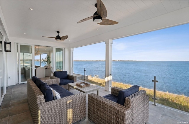 view of patio / terrace with an outdoor hangout area, ceiling fan, and a water view