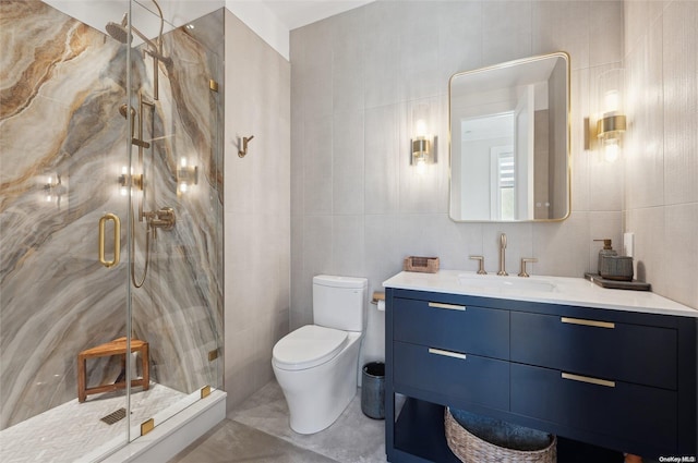 bathroom featuring toilet, vanity, tile walls, and walk in shower