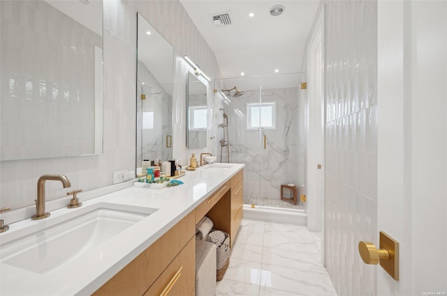 bathroom featuring tile walls, a shower with shower door, and vanity