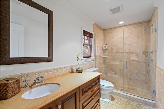 bathroom with walk in shower, vanity, tile walls, and toilet