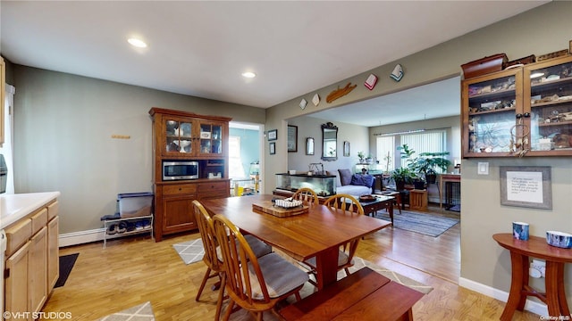 dining space featuring light wood-type flooring