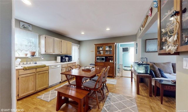 kitchen featuring dishwasher, light brown cabinets, sink, a wall mounted AC, and light hardwood / wood-style floors