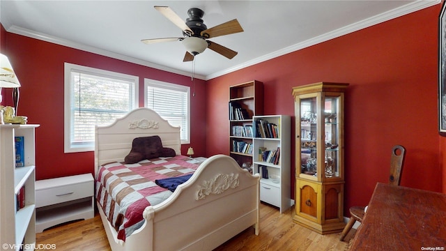 bedroom with ceiling fan, light hardwood / wood-style floors, and ornamental molding