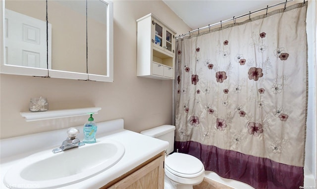 full bathroom featuring vanity, shower / bath combination with curtain, and toilet