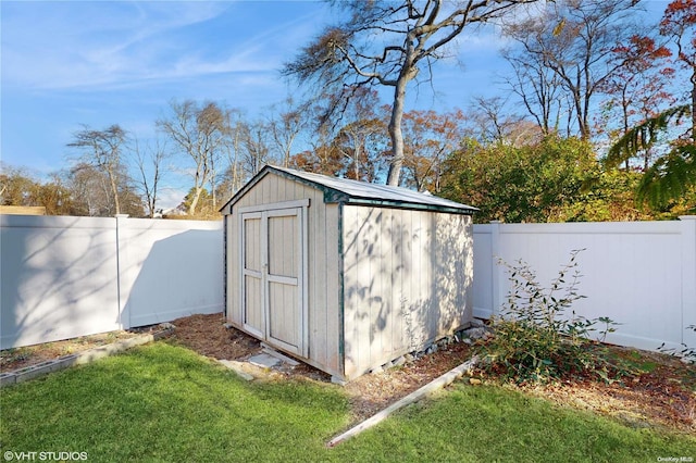 view of outdoor structure with a lawn