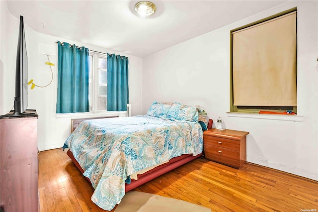 bedroom with light wood-type flooring