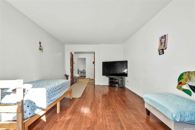 bedroom with hardwood / wood-style floors