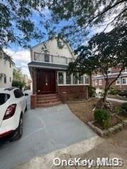 front of property featuring a balcony