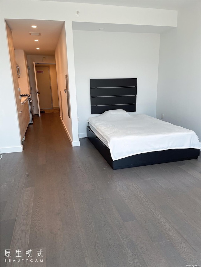 131-05 40th Rd Unit Ph1T, Flushing, NY 11354 - bedroom with dark wood finished floors, baseboards, and recessed lighting