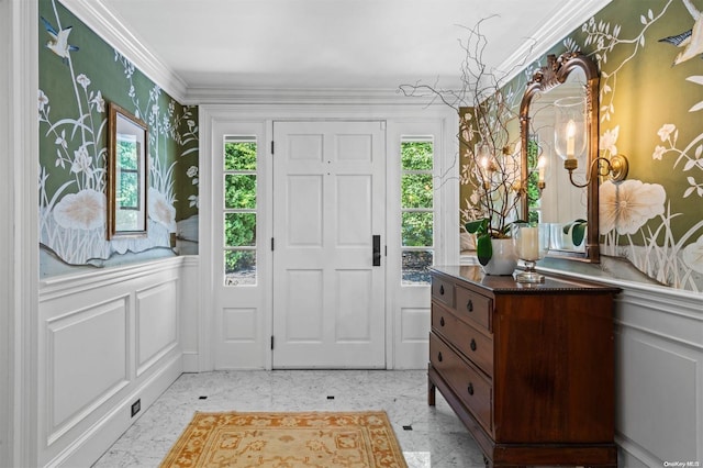 foyer with a healthy amount of sunlight and crown molding