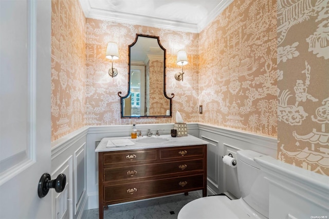 bathroom with crown molding, vanity, and toilet