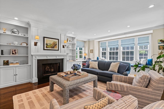 living room featuring crown molding, dark hardwood / wood-style flooring, and built in features