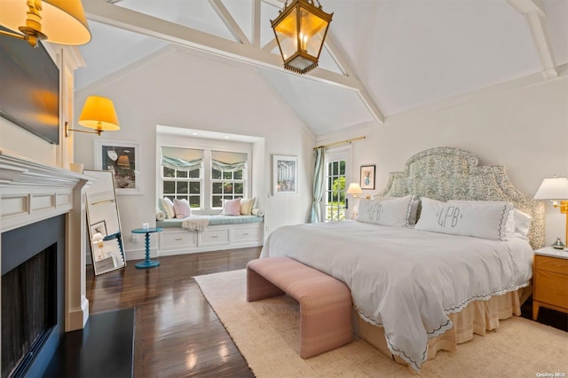 bedroom featuring hardwood / wood-style floors, high vaulted ceiling, and beam ceiling