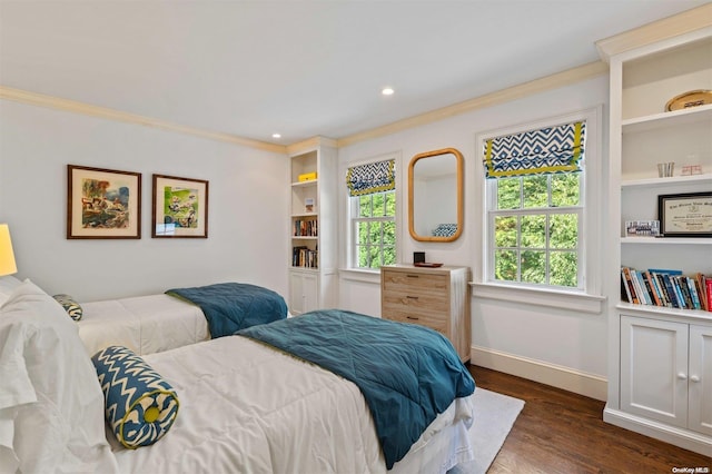 bedroom with dark hardwood / wood-style floors and ornamental molding