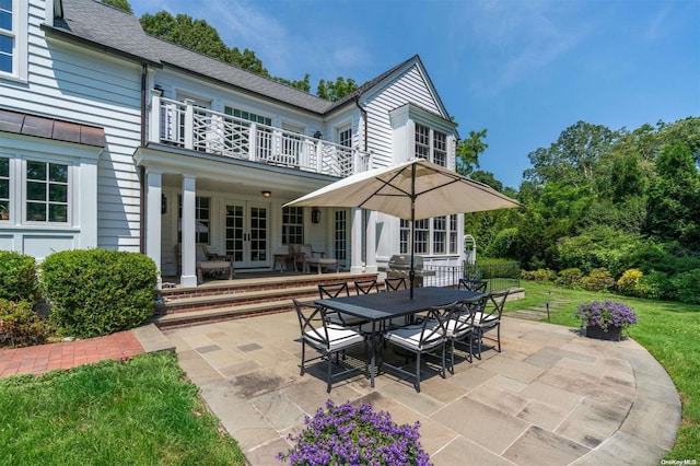 view of patio featuring french doors and a balcony