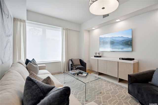 living room with light hardwood / wood-style flooring